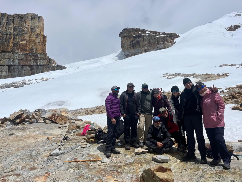 Family in the top of a moutain in the Pan de Azucar glcaier in Cocuy National Park in Colombia