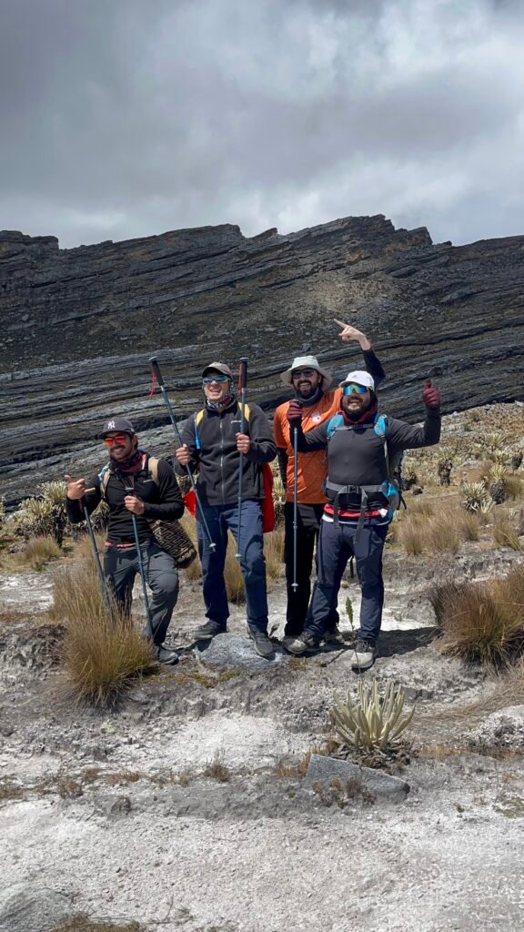 group of friends celbrating in the trail towards ritacuba blanco glacier