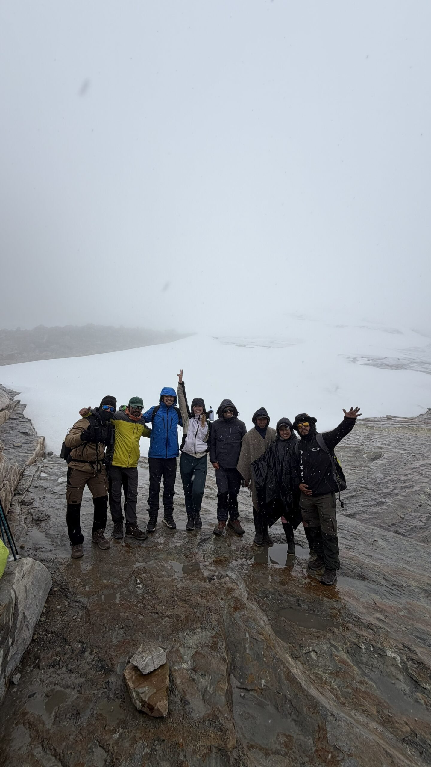 Family celebrating at the top of the mountain