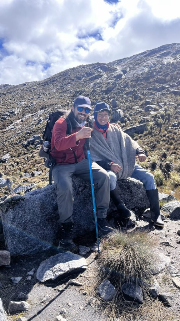 Mountain guide with local community member in the Colombian Andes during a cultural trekking experience