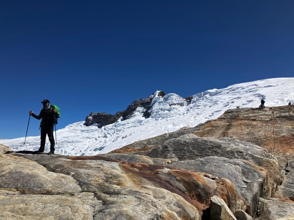 High-altitude hiker near El Cocuy glacier in the Colombian Andes during a guided mountain expedition