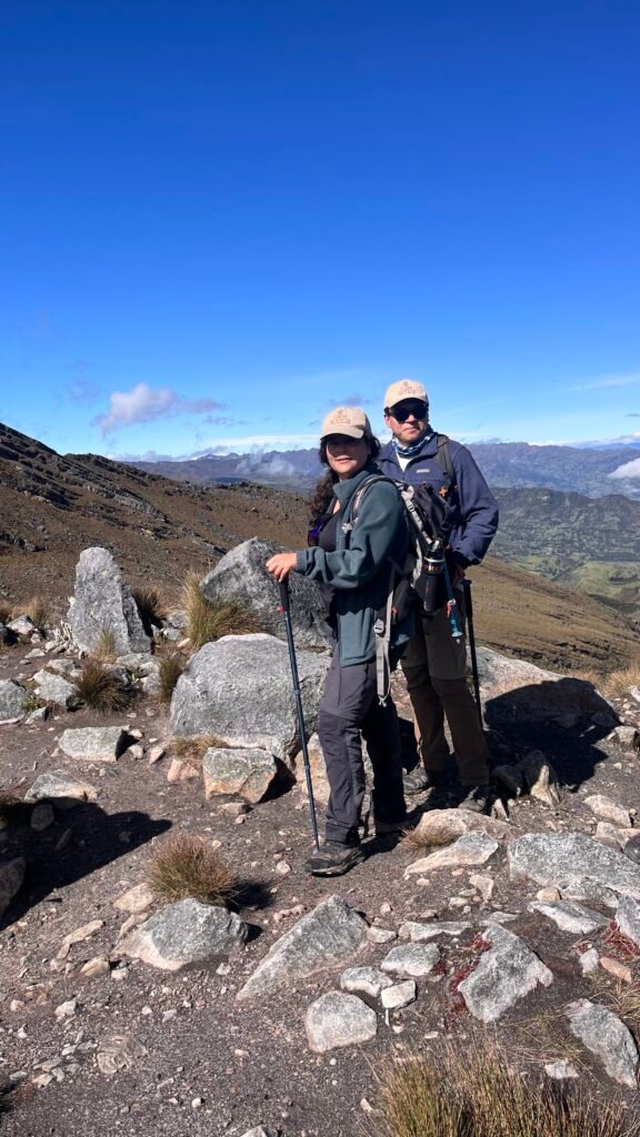 couple in the trail of cocuy national park with poles
